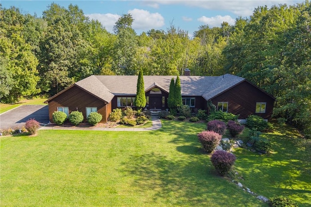 ranch-style house with a front lawn