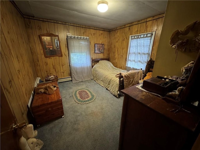 carpeted bedroom featuring wooden walls and a baseboard radiator