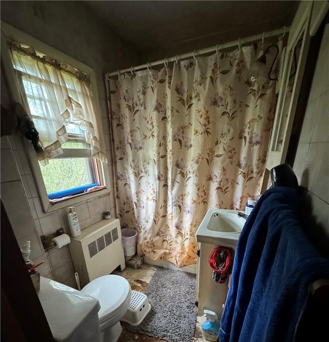 3038 State Route 17b, Cochecton, NY 12726 - bathroom featuring radiator, vanity, and a shower with curtain