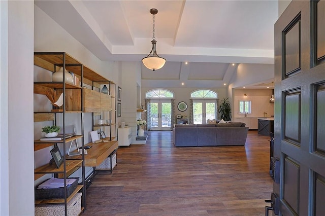 entryway featuring beamed ceiling, dark wood-type flooring, and french doors