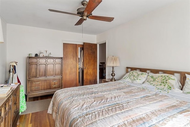 bedroom with wood-type flooring, a closet, and ceiling fan