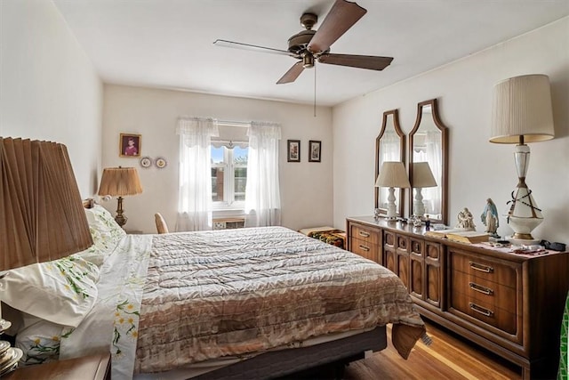 bedroom featuring ceiling fan and light hardwood / wood-style floors