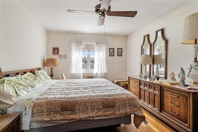 bedroom featuring light hardwood / wood-style floors and ceiling fan