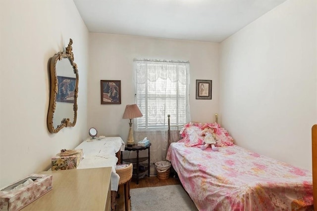 bedroom featuring wood-type flooring