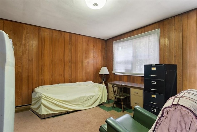 bedroom with wooden walls and carpet