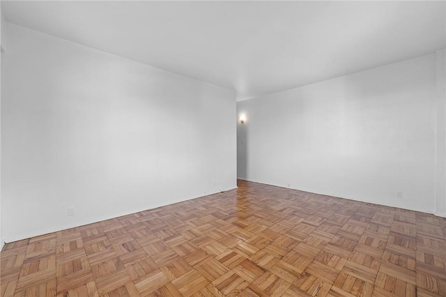 empty room with light parquet flooring