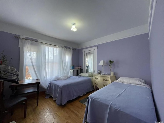 bedroom with hardwood / wood-style flooring