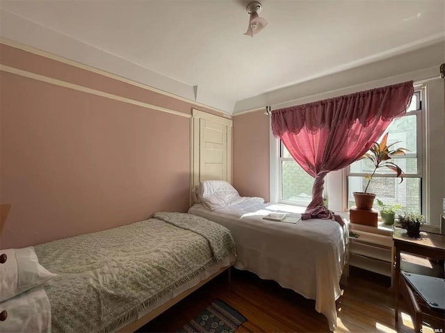 bedroom featuring dark hardwood / wood-style floors