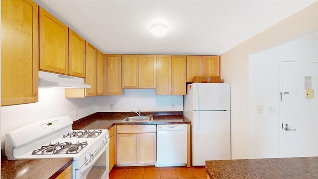 kitchen with white appliances, sink, and light tile patterned floors