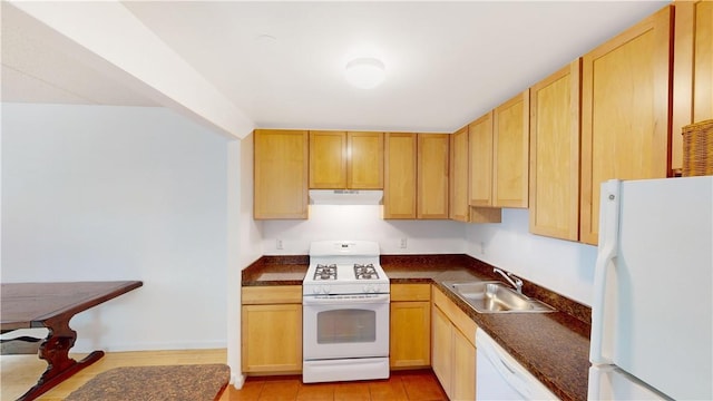 kitchen with light brown cabinets, white appliances, sink, and light tile patterned floors