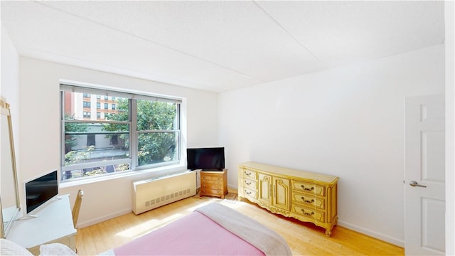 interior space featuring hardwood / wood-style flooring and radiator