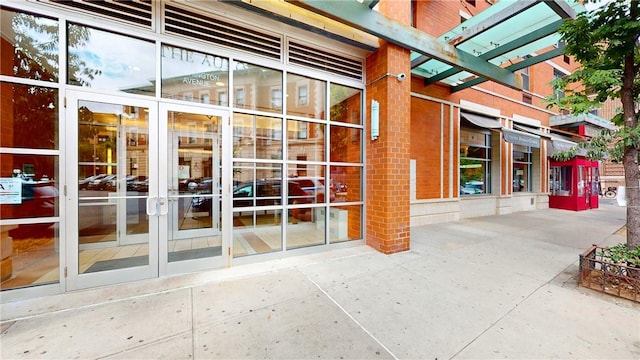 view of exterior entry featuring a pergola