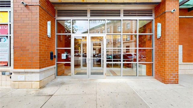 view of exterior entry featuring french doors