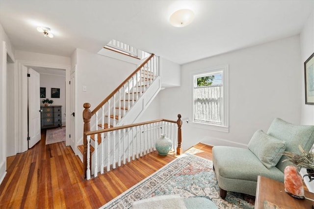 stairs featuring wood-type flooring