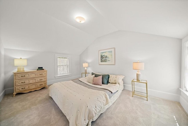 bedroom featuring carpet and vaulted ceiling