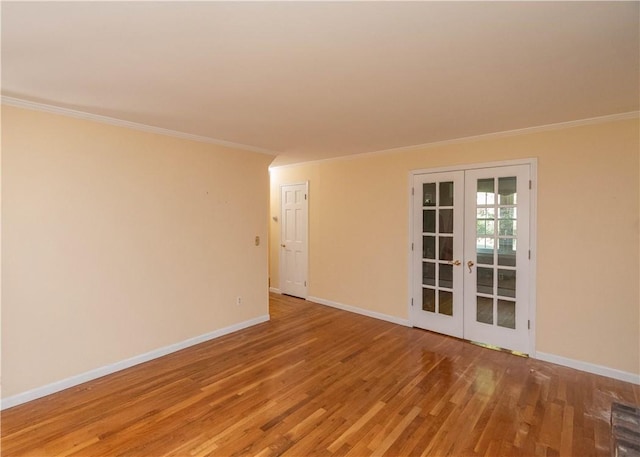 unfurnished room with french doors, hardwood / wood-style floors, and ornamental molding