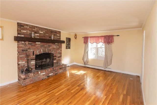 36 Boulder Dr, Cornwall, NY 12553 - unfurnished living room featuring wood finished floors, crown molding, a fireplace, and baseboards