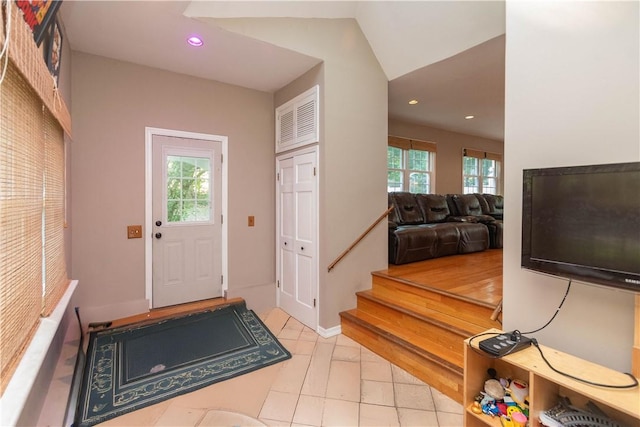 entrance foyer featuring plenty of natural light and lofted ceiling