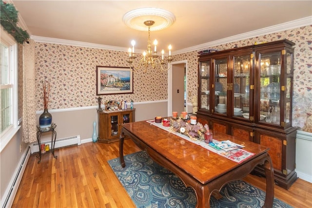 dining area with a chandelier, a baseboard radiator, light hardwood / wood-style flooring, and crown molding