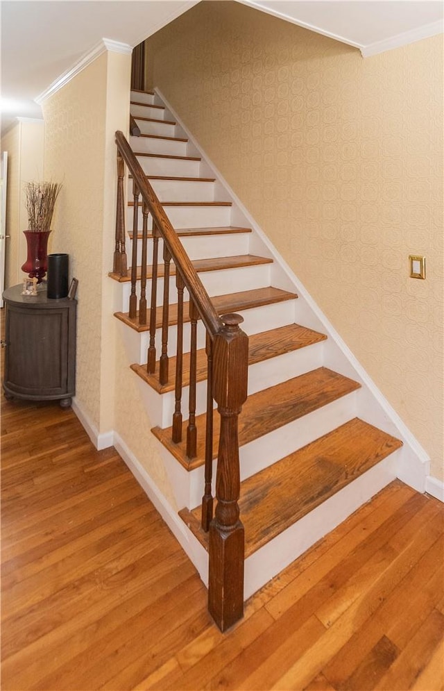 36 Boulder Dr, Cornwall, NY 12553 - staircase with wood finished floors, ornamental molding, baseboards, and wallpapered walls