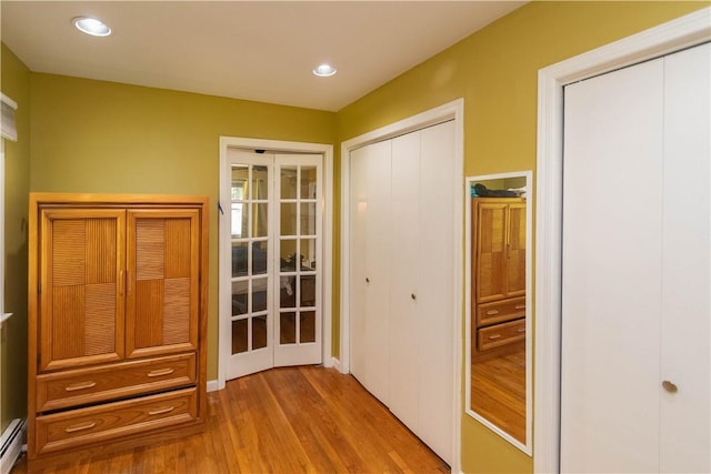 36 Boulder Dr, Cornwall, NY 12553 - hallway with baseboard heating, wood finished floors, and recessed lighting