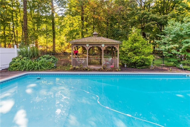 view of swimming pool featuring a gazebo