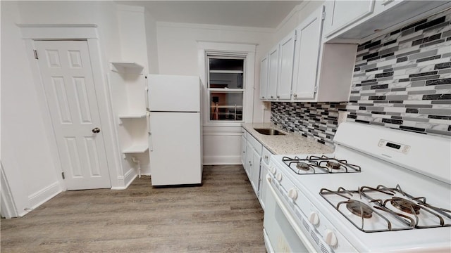 kitchen with backsplash, ornamental molding, white appliances, light hardwood / wood-style flooring, and white cabinetry