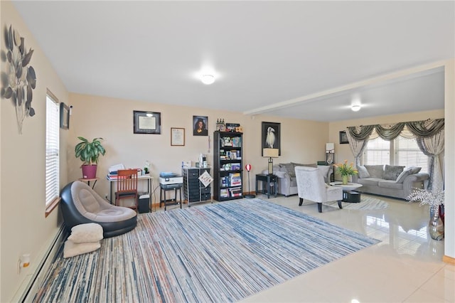 tiled living room featuring a baseboard heating unit