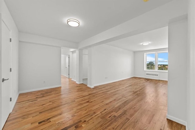 90 Union St Unit 6G, New Rochelle, NY 10805 - spare room with radiator heating unit and light hardwood / wood-style flooring