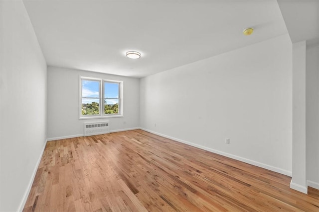 90 Union St Unit 6G, New Rochelle, NY 10805 - empty room with radiator and light wood-type flooring