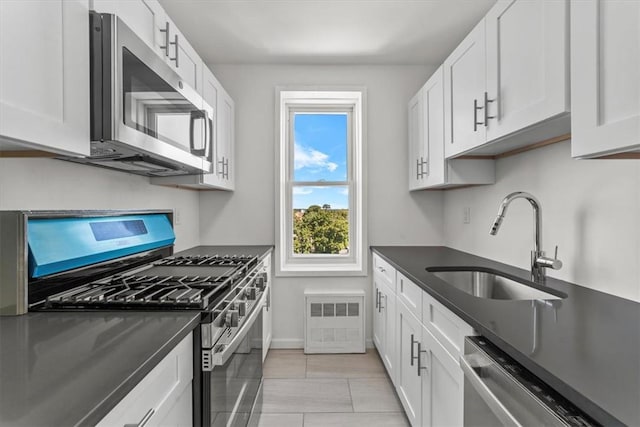 90 Union St Unit 6G, New Rochelle, NY 10805 - kitchen featuring white cabinets, sink, and stainless steel appliances
