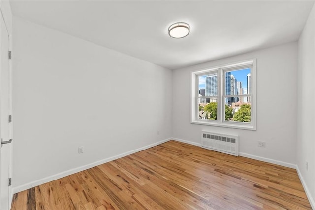 90 Union St Unit 6G, New Rochelle, NY 10805 - spare room featuring light hardwood / wood-style floors and radiator