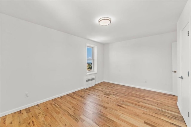 90 Union St Unit 6G, New Rochelle, NY 10805 - spare room featuring radiator heating unit and light wood-type flooring