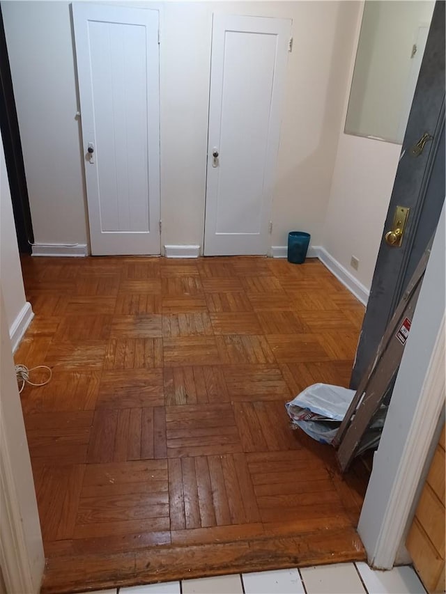 corridor featuring light parquet floors