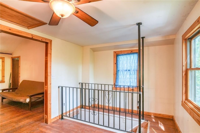 hallway with hardwood / wood-style floors