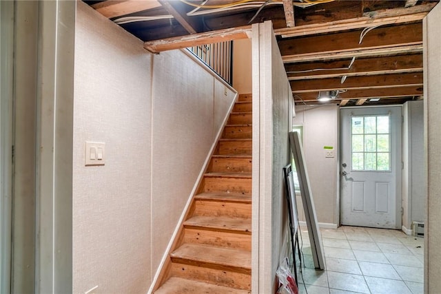 stairway featuring tile patterned floors