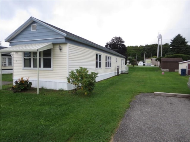 view of home's exterior with a yard