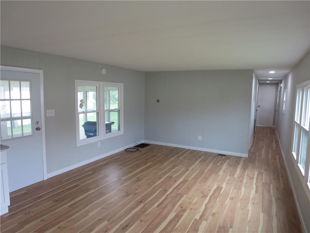 unfurnished room featuring light hardwood / wood-style flooring