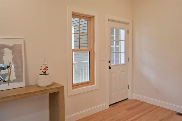 doorway with light hardwood / wood-style flooring