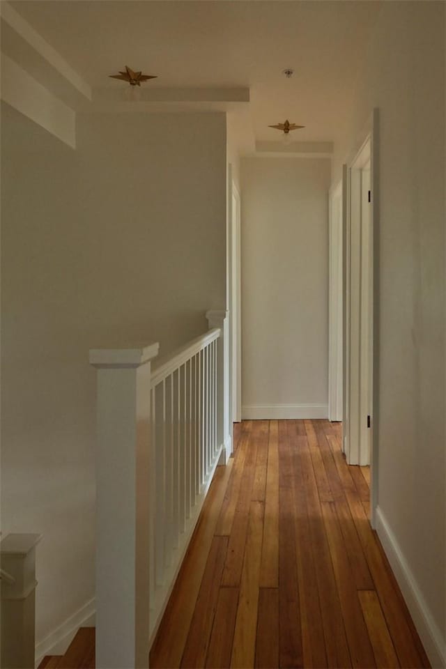 hallway with light hardwood / wood-style flooring