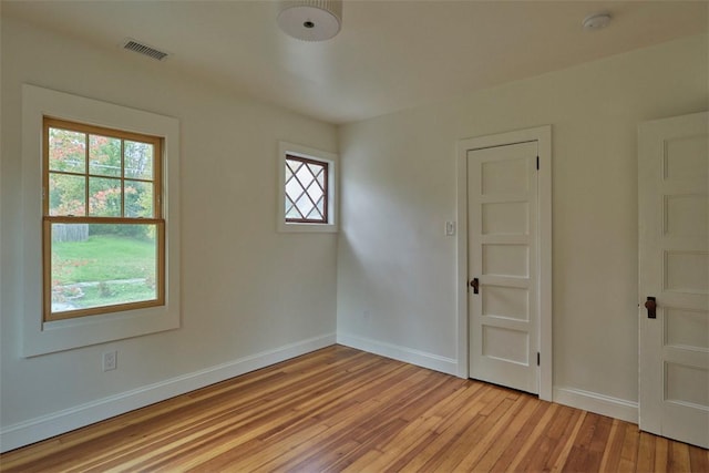 empty room with light hardwood / wood-style floors