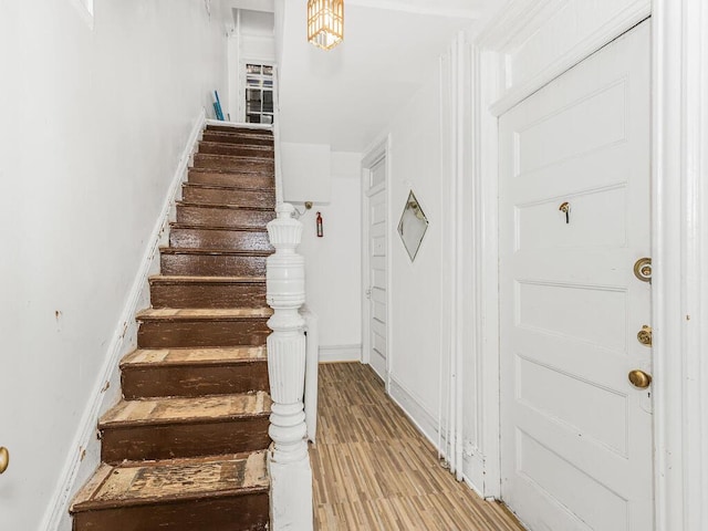 staircase featuring hardwood / wood-style floors