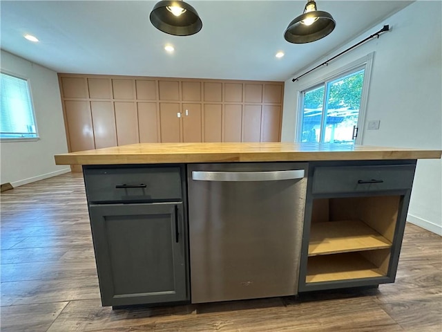 kitchen with wooden counters, gray cabinetry, wood finished floors, and dishwasher