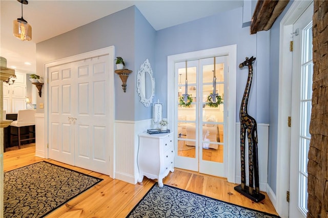 entryway with light hardwood / wood-style floors