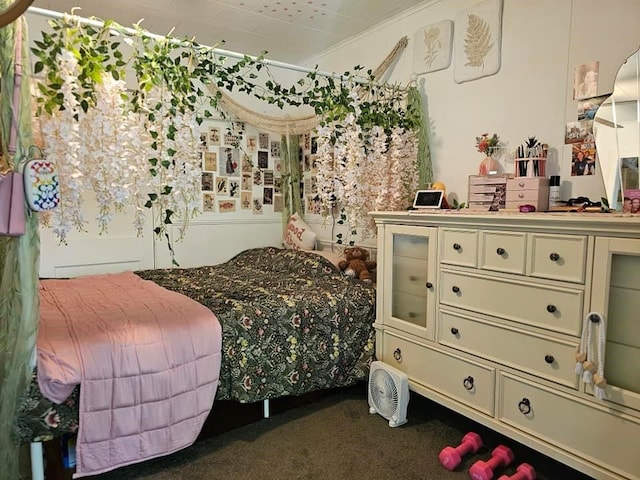 carpeted bedroom featuring ornamental molding