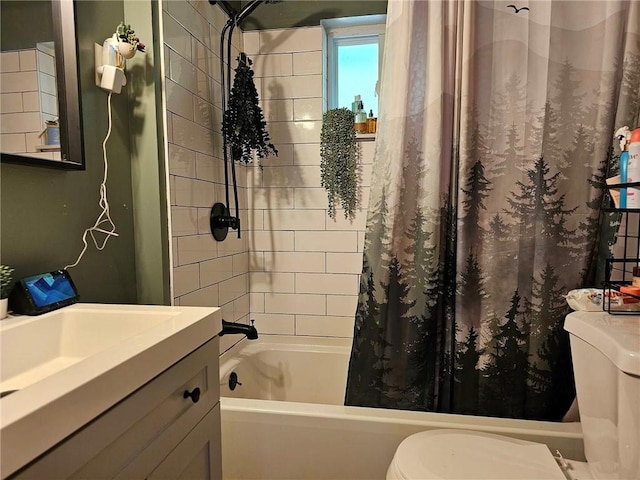 full bathroom featuring vanity, shower / tub combo, and toilet