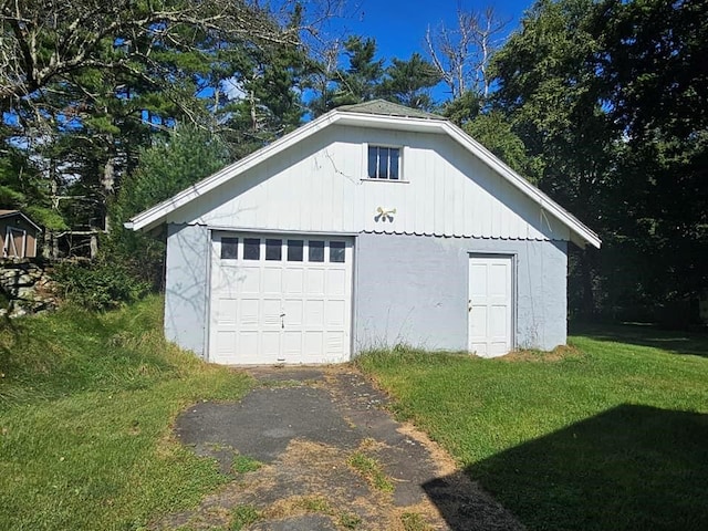 garage with a lawn