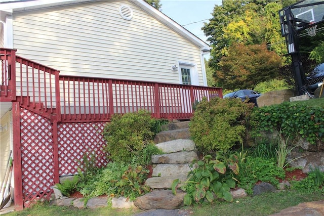 view of property exterior featuring a wooden deck