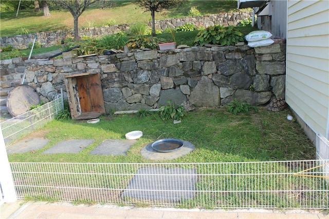 view of yard with a fire pit