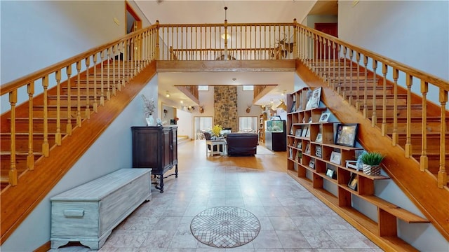 staircase featuring a towering ceiling